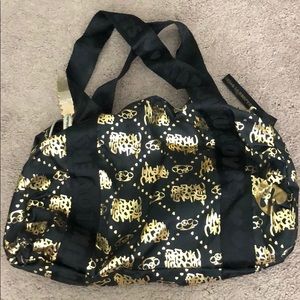 Black and gold Harajuku lovers purse